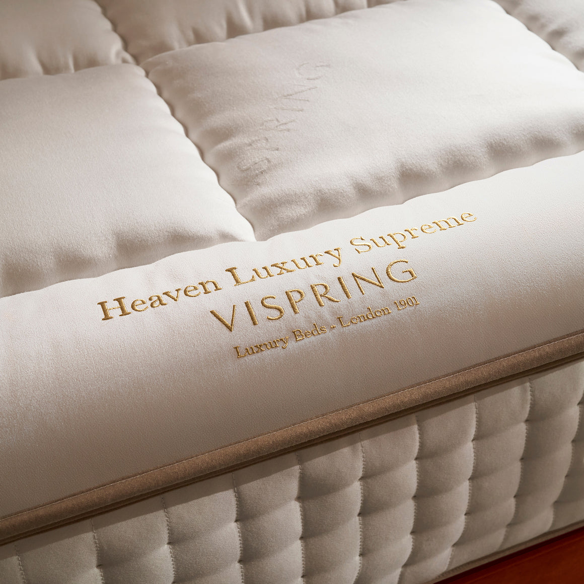 Vispring Heaven Luxury Supreme Topper with close-up detail of embroidery.