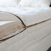 Naturepedic EOS Classic detail shot of mattress unzipped with organic latex exposed.